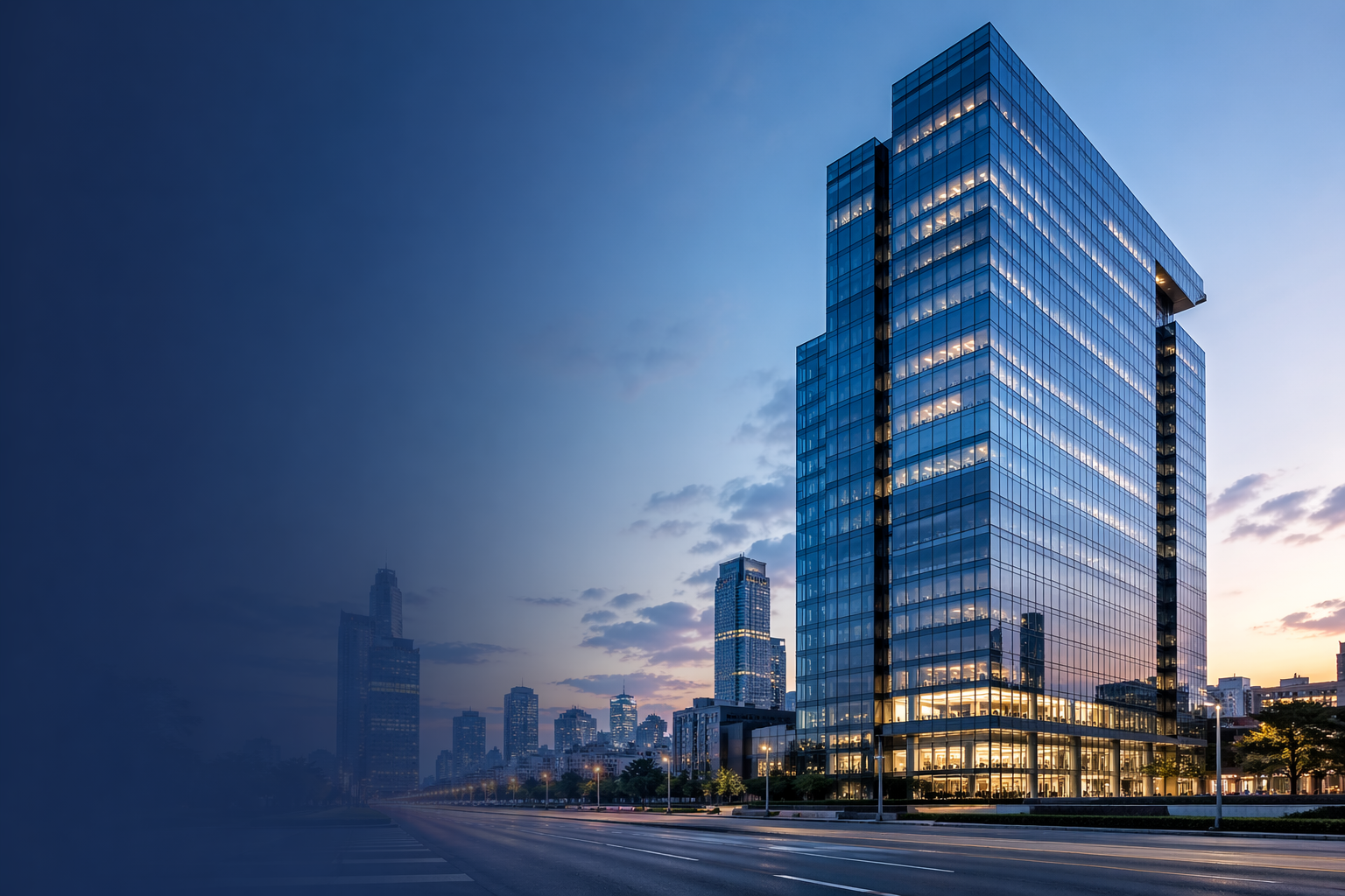 Illuminated multi-story commercial skyscraper situated on a main downtown street, surrounded by other high-rise commercial properties.